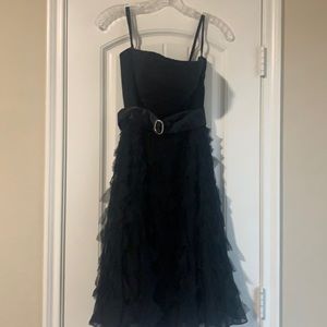 Black satin strapless dress. Shirt is detailed. Size 0